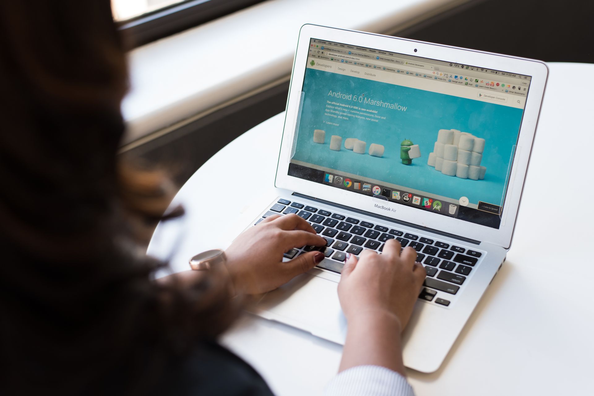 Person updating a website on a laptop